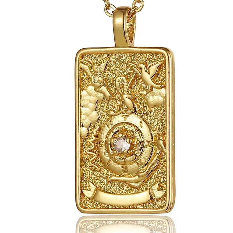 AuraTemple gold stainless steel necklace with a rectangular pendant featuring intricate tarot card designs and a central cubic zirconia.