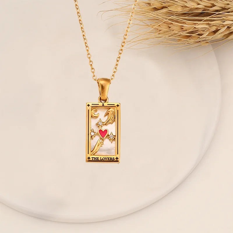 AuraTemple gold stainless steel necklace featuring a rectangular pendant with a Tarot card design, including a red heart, moon, and stars.