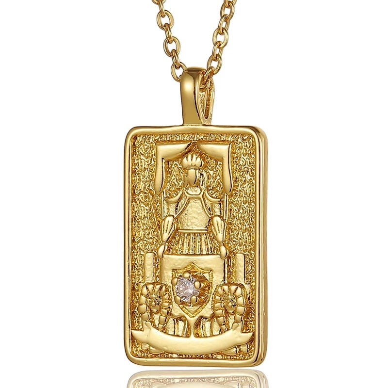 AuraTemple gold stainless steel necklace with a rectangular pendant featuring a detailed embossed tarot card design and a central cubic zirconia.