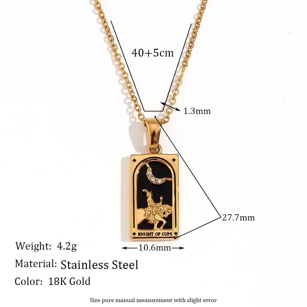 AuraTemple 18K gold stainless steel necklace featuring a rectangular pendant with a black enamel tarot card design, a knight on horseback under a crescent moon with cubic zirconia.